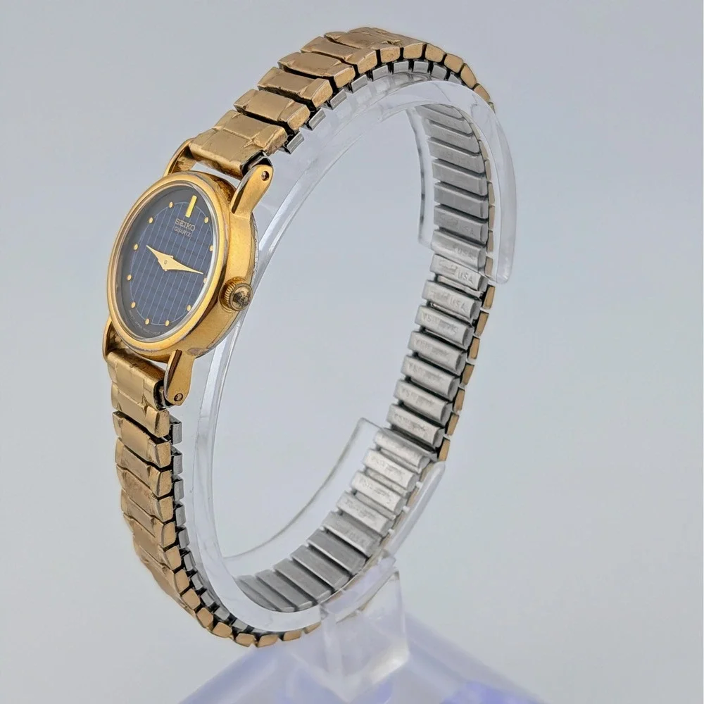 Vintage Seiko 1N00-0F60 Blue Woven Grid Textured Dial Gold Tone Watch 20mm